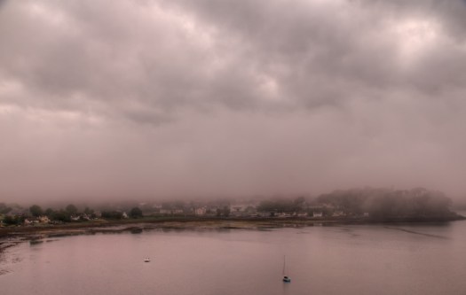 Portree covered in fog.