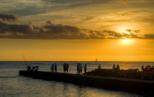 Gathering at the beach to watch the sunset