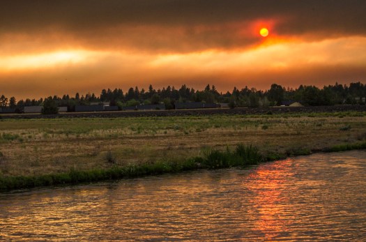 Sun setting behind smoke bank