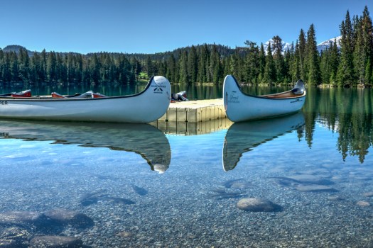 Look closely and you can see fish swimming in front of the canoes